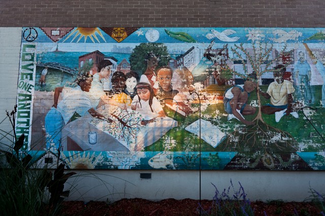 'love one another' - mural outside the Patrick Daly school