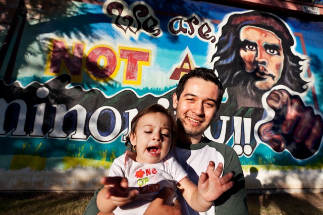 yeah, what he said - Ashley and Omar in front of 'We are NOT a minority' Che Guevara mural